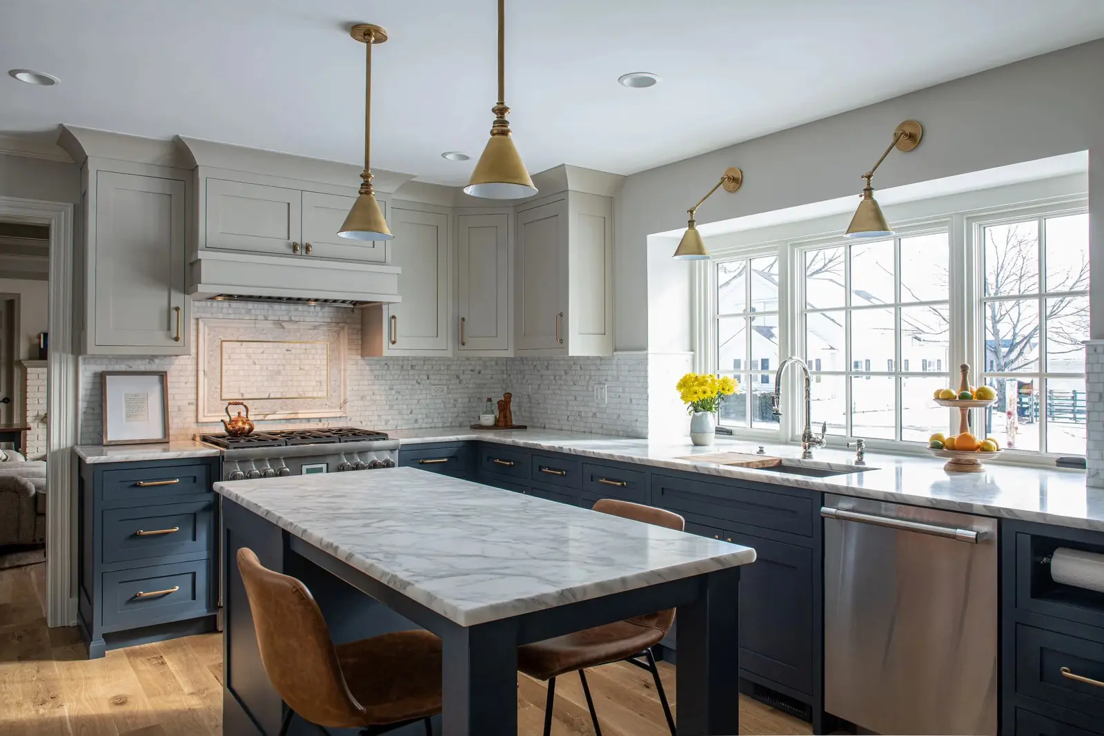 Kitchen remodel with navy island and marble countertop